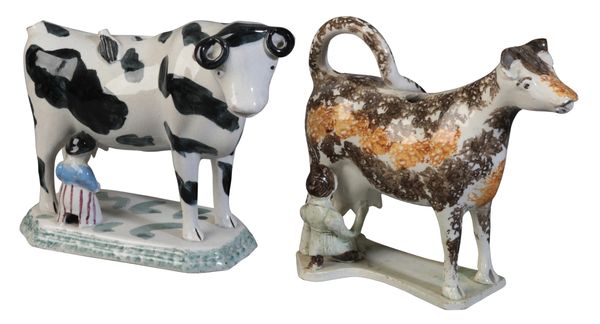 A SPONGEWARE POTTERY COW CREAMER