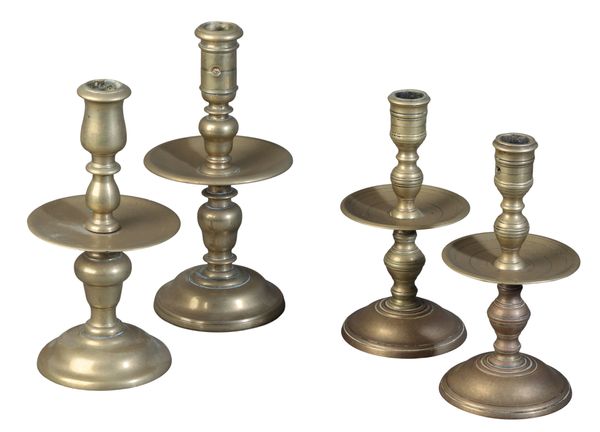 A PAIR OF BRASS CANDLESTICKS