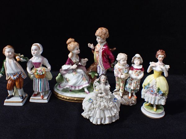 A GROUP OF SIX PORCELAIN FIGURES