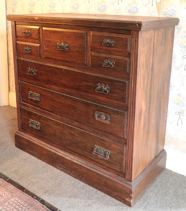 AN EDWARDIAN GRAINED WOOD CHEST OF DRAWERS BY MAPLE & CO