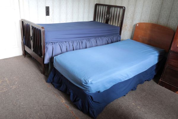 A STAINED OAK SINGLE BED