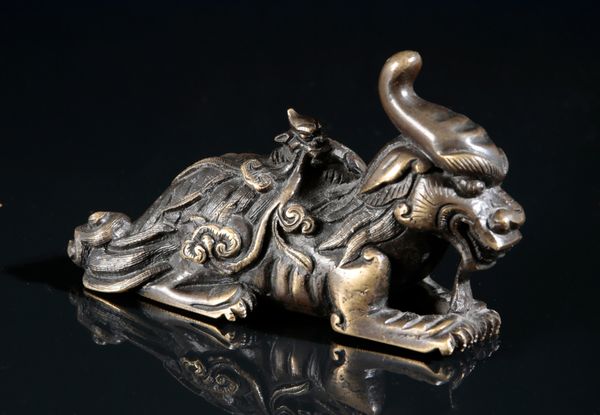 A CHINESE BRONZE FIGURE OF A LUDUAN