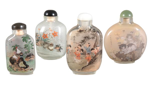 A GROUP OF FOUR CHINESE INSIDE PAINTED GLASS SNUFF BOTTLES