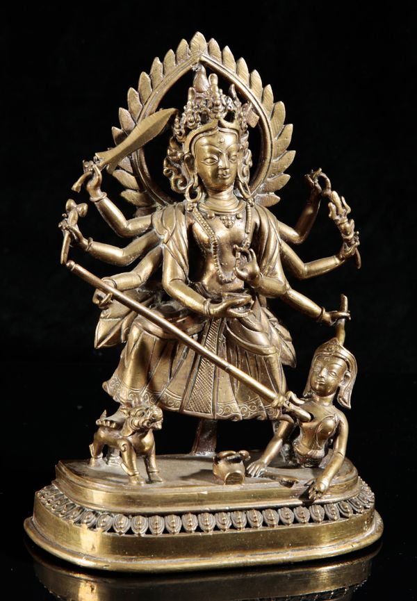 A NEPALESE GILT BRONZE FIGURE OF DURGA