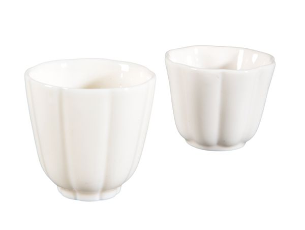 A NEAR PAIR OF PORCELAIN BLANC DE CHINE TEA CUPS