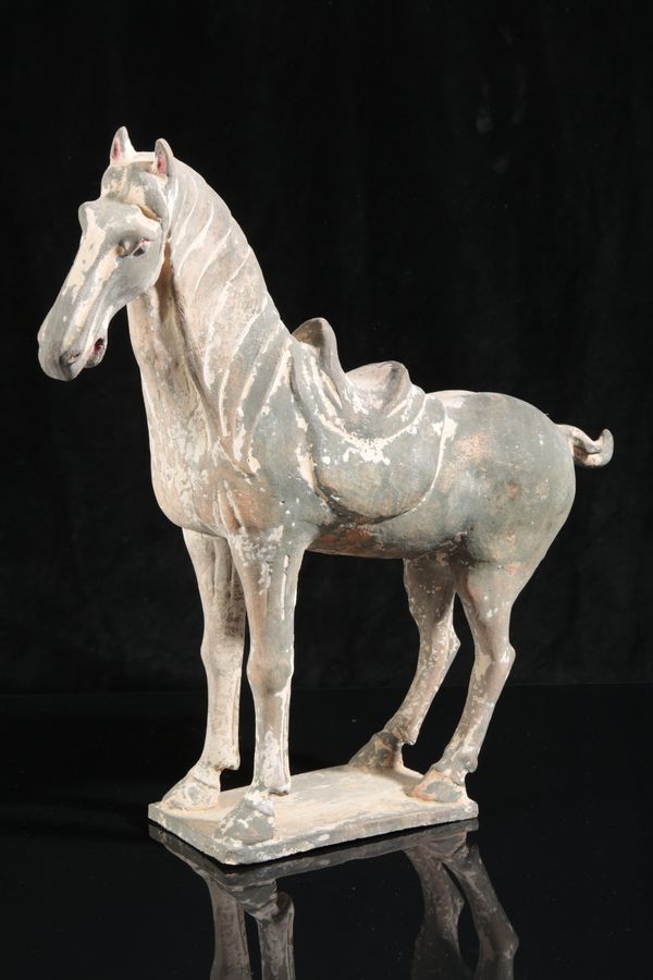 A CHINESE POTTERY FIGURE OF A HORSE