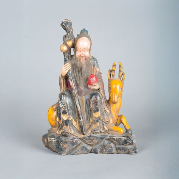 A CHINESE CARVED AND POLYCHROME PAINTED SOAPSTONE GROUP OF SHOU LAO