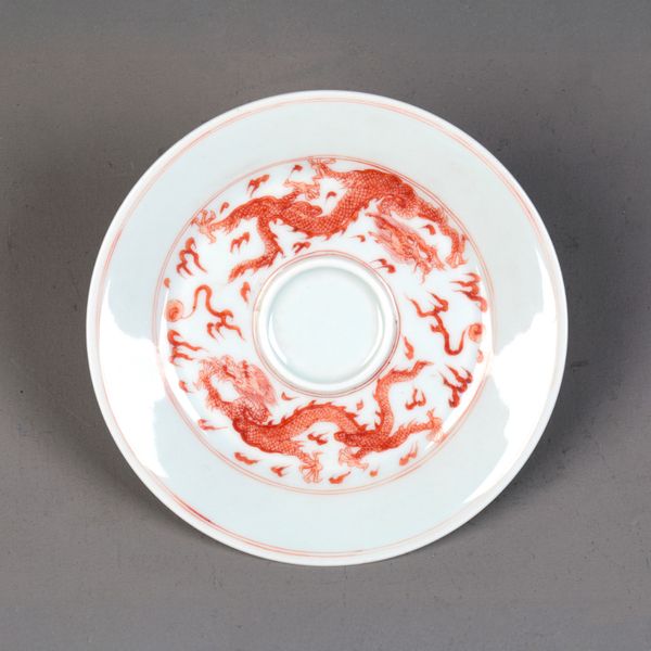 A CHINESE PORCELAIN RED GLAZED SAUCER
