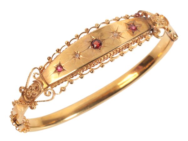 AN ETRUSCAN REVIVAL RUBY, GARNET AND DIAMOND BANGLE