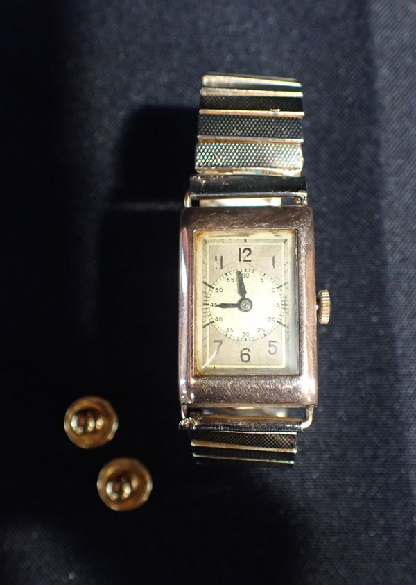 A 9CT GOLD CASE OBLONG FACED WATCH