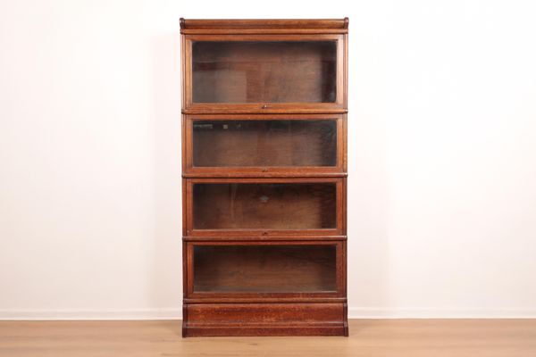 GLOBE WERNICKE: AN OAK STACKING SECTIONAL LIBRARY BOOKCASE