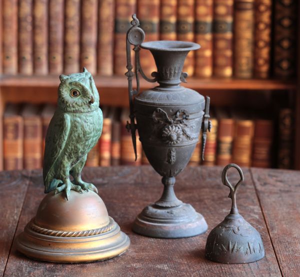A PATINATED METAL FIGURAL INKWELL