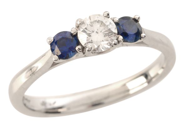 A DIAMOND AND SAPPHIRE THREE STONE RING