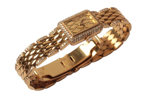 CARTIER TANK: A LADY'S 18CT GOLD AND DIAMOND ENCRUSTED BRACELET WATCH