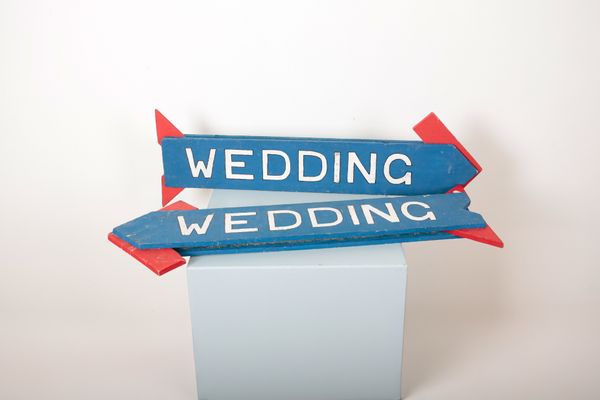 TWO POLYCHROME PAINTED WOODEN 'WEDDING' VENUE ARROW SIGNS