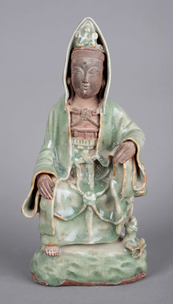 A CHINESE PORCELAIN CELADON GLAZED FIGURE OF GUANYIN