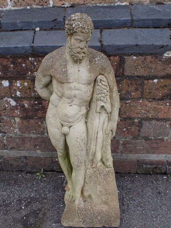 A RECONSTITUTED STONE GARDEN FIGURE