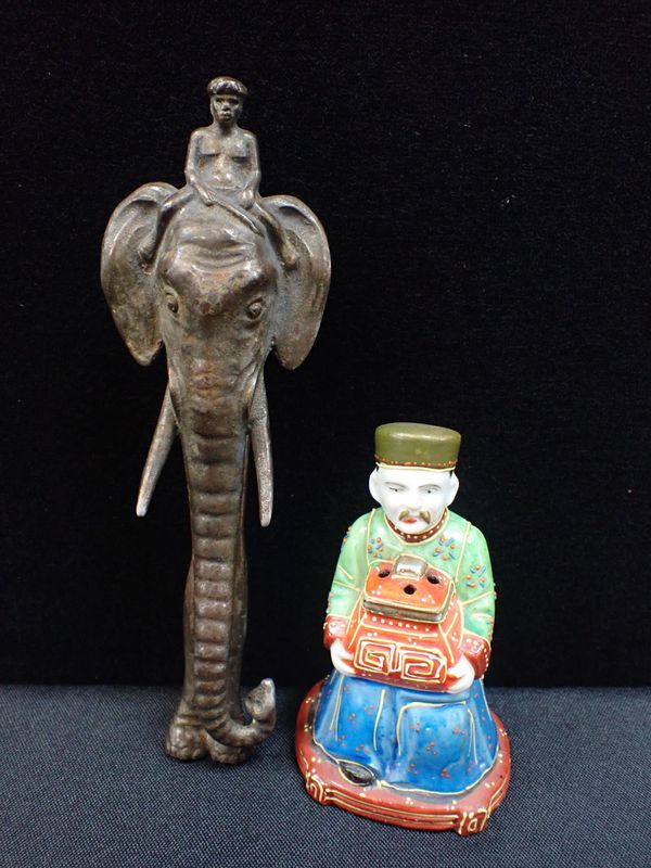 A NOVELTY INDIAN ELEPHANT AND RIDER NUTCRACKER