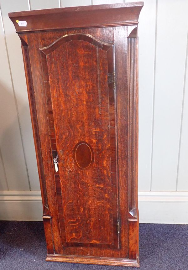 A SMALL OAK AND MAHOGANY CROSSBANDED CORNER CUPBOARD