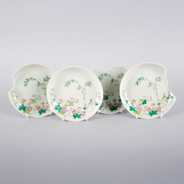 A SET OF FOUR CHINESE PORCELAIN FAMILLE ROSE SAUCERS
