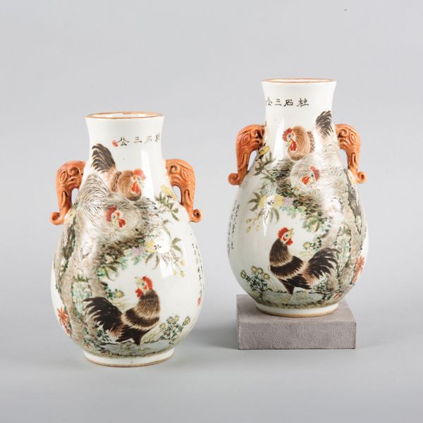 A PAIR OF CHINESE PORCELAIN FAMILLE ROSE VASES