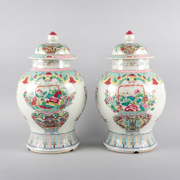 A PAIR OF CHINESE PORCELAIN FAMILLE ROSE BALUSTER VASES AND COVERS