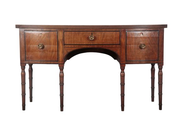 A REGENCY MAHOGANY AND EBONY CROSSBANDED BOW FRONT SIDEBOARD