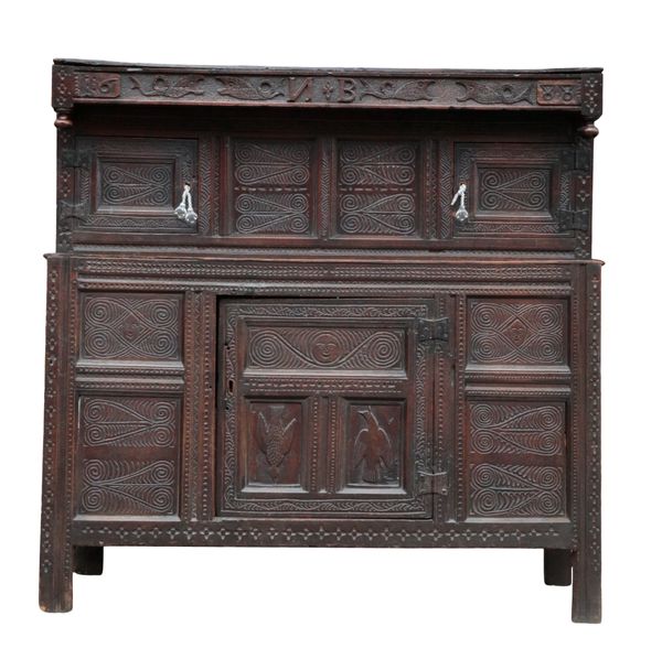 A PANELLED OAK COURT CUPBOARD