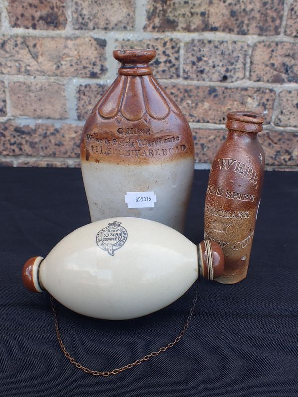 TWO EARLY 19th CENTURY SALTGLAZED STONEWARE SPIRIT FLASKS