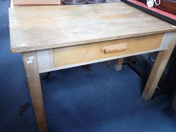 A PINE TOPPED KITCHEN TABLE