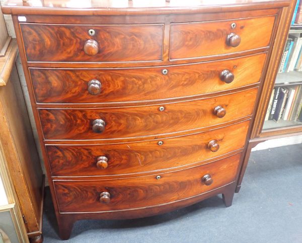 A 19th CENTURY FIGURED MAHOGANY BOW FRONT CHEST OF DRAWERS