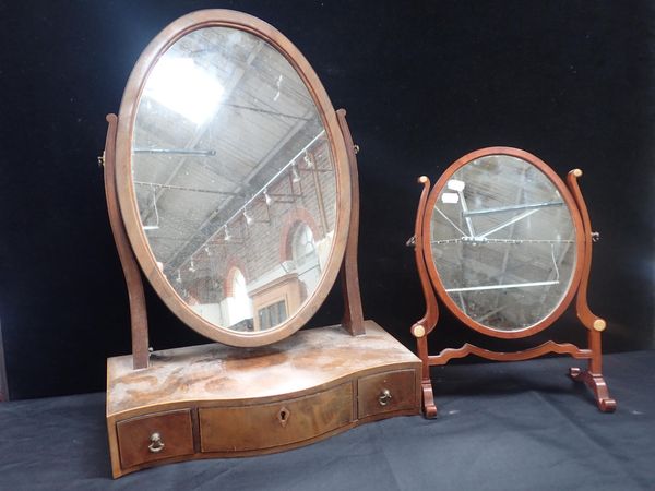 A GEORGE III STYLE OVAL DRESSING MIRROR