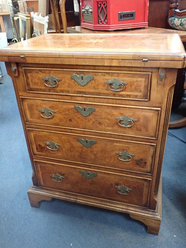 A REPRODUCTION WALNUT BACHELOR'S CHEST