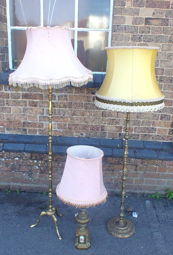 A BRASS TRIPOD STANDARD LAMP