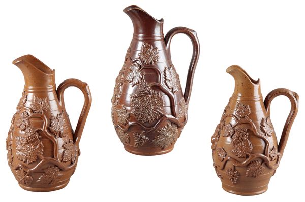 A GROUP OF THREE SALT GLAZED STONEWARE JUGS