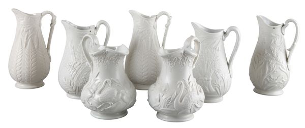 A COLLECTION OF SEVEN VICTORIAN RELIEF MOULDED STONEWARE JUGS