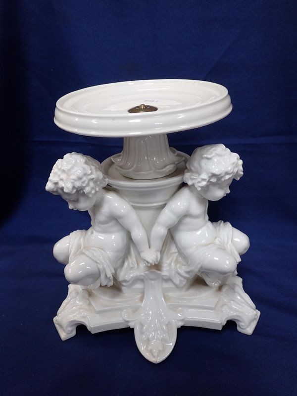 A FRENCH WHITE GLAZED TAZZA BASE/STAND, THREE CHERUBS