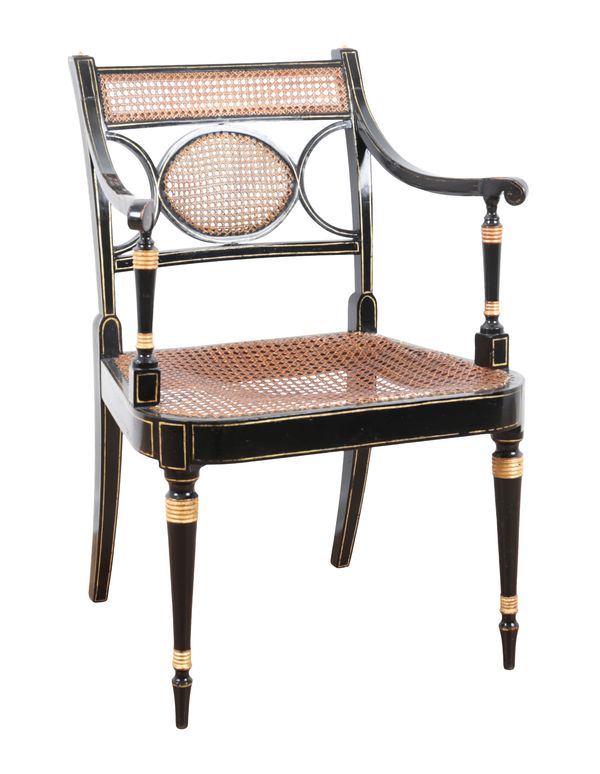 A REGENCY EBONISED AND CANED OCCASIONAL OPEN ARMCHAIR