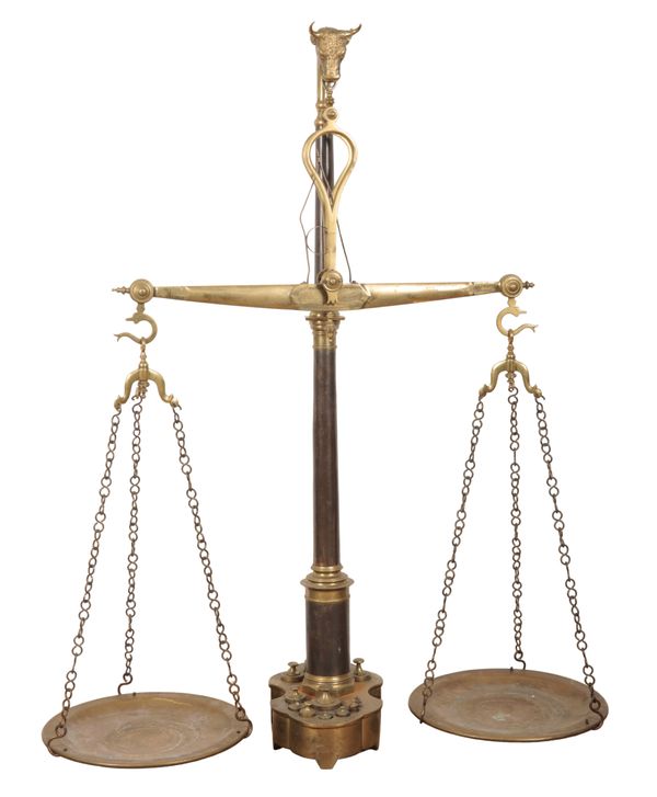 A SET OF FLOOR STANDING GIANT BRASS BUTCHER'S SCALES