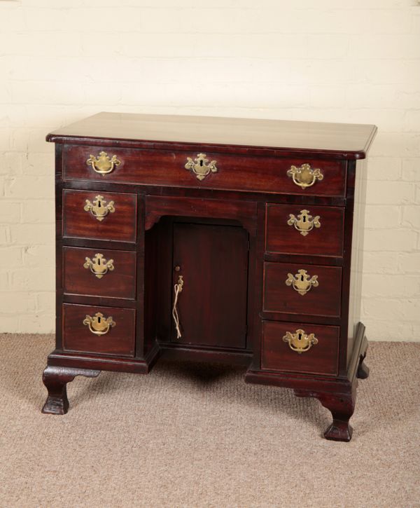 A GEORGE II MAHOGANY KNEEHOLE DESK