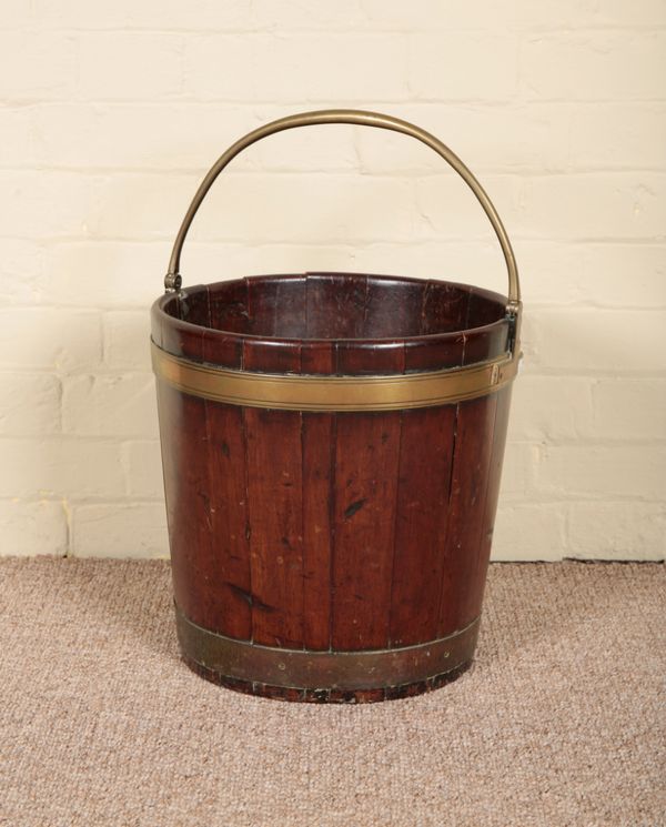 A MAHOGANY AND BRASS BOUND PEAT BUCKET