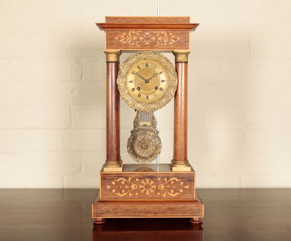 A FRENCH ROSEWOOD AND MARQUETRY PORTICO CLOCK