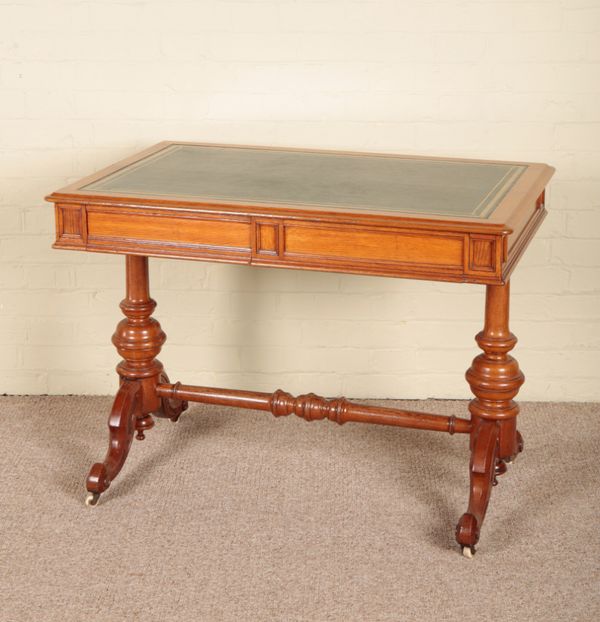 A VICTORIAN OAK WRITING TABLE