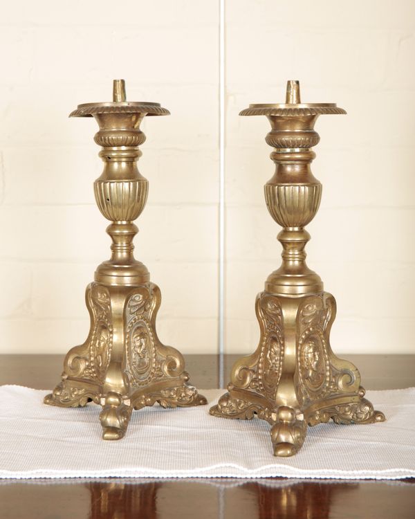 A PAIR OF CONTINENTAL BRASS PRICKET CANDLESTICKS