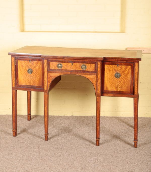 A GEORGE III SATINWOOD BREAKFRONT SIDEBOARD