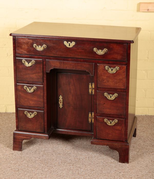 A GEORGE II MAHOGANY KNEEHOLE DESK