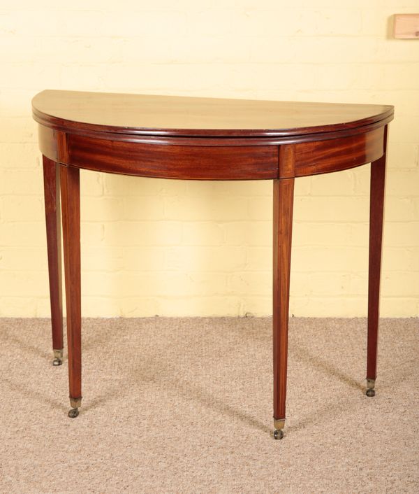 A GEORGE III MAHOGANY DEMI-LUNE TEA TABLE