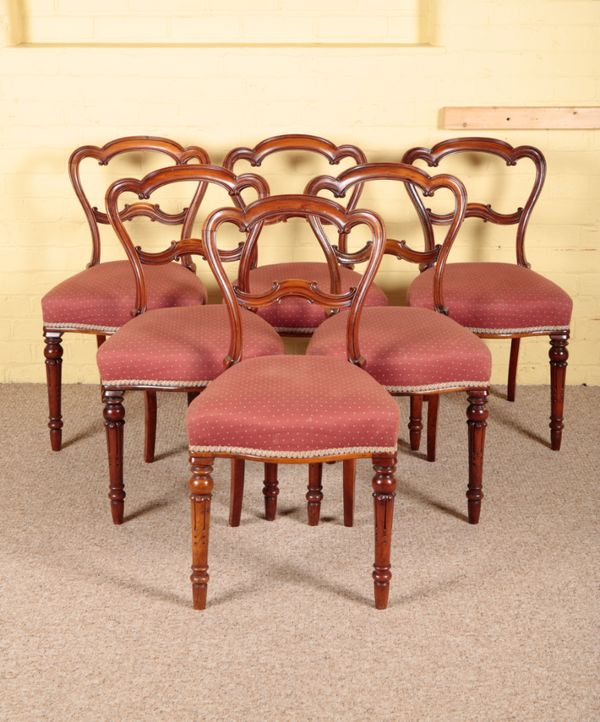 A SET OF SIX VICTORIAN WALNUT BALLOON BACK DINING CHAIRS