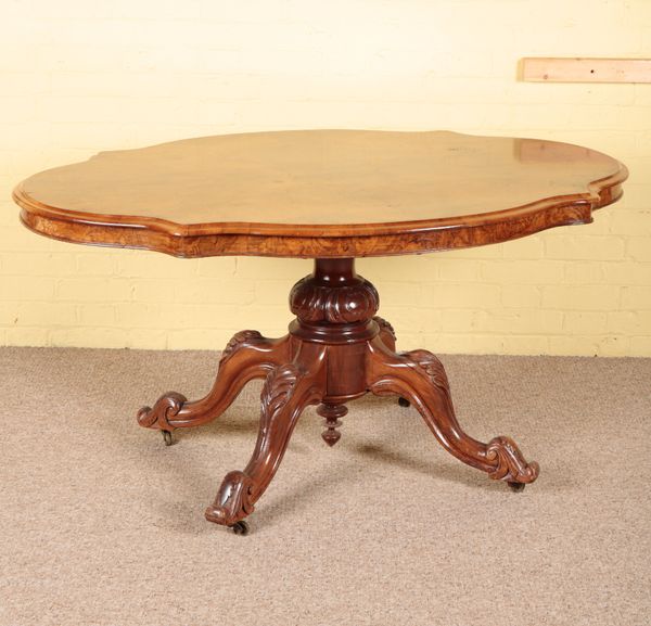 A VICTORIAN WALNUT CENTRE TABLE