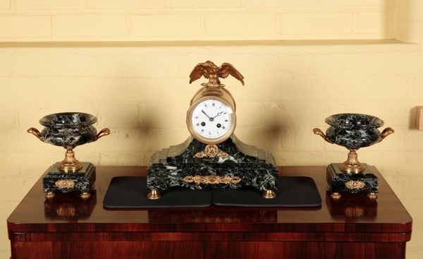 A VERDE ANTICO AND GILT METAL MANTEL CLOCK WITH GARNITURE